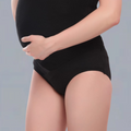Person wearing a black  MATERNITY underwear on a gray background