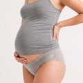 A pregnant model wearing a heather gray maternity tank top and matching gray briefs, shown from the chest down against a plain light background.